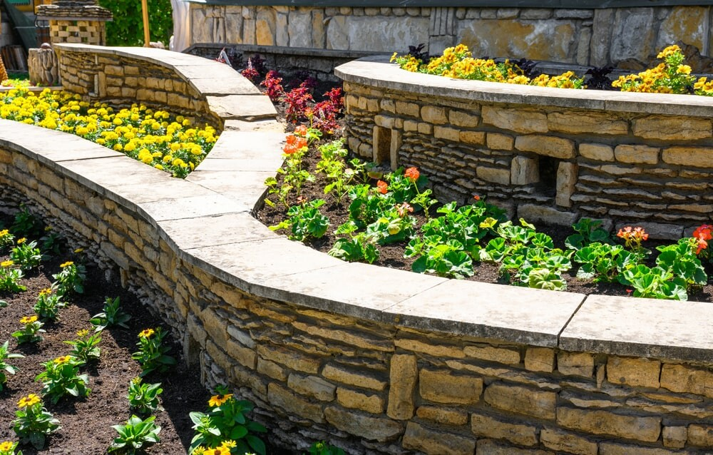 Garden beds with retaining walls in residential landscape