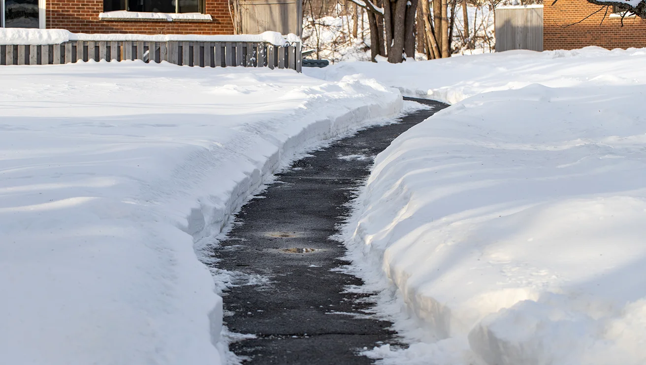 A path to a home cleared of snow.