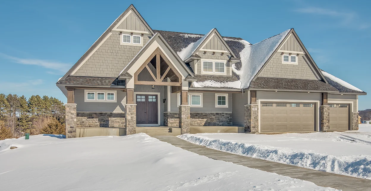 A house in winter covered in snow.