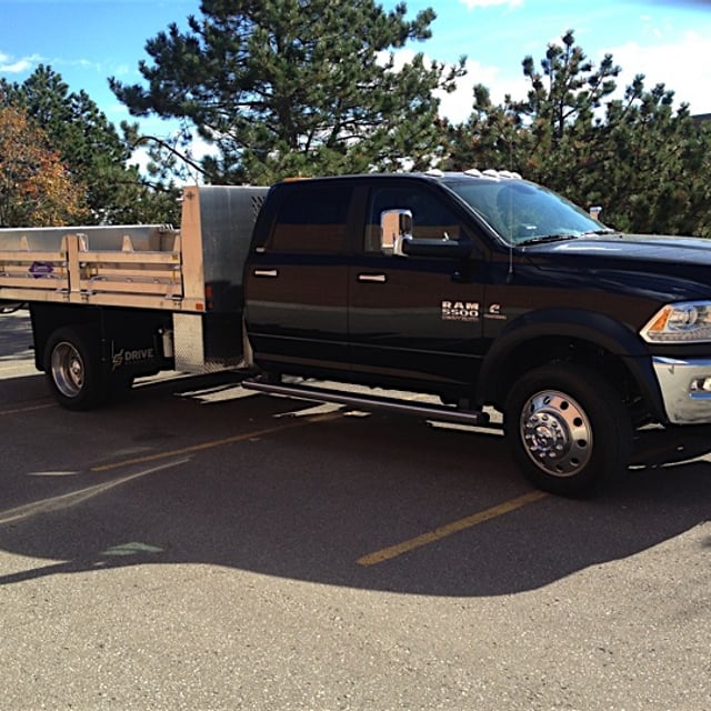 A Black Ground Guys work truck.