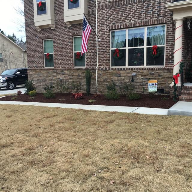 A front lawn with a garden.