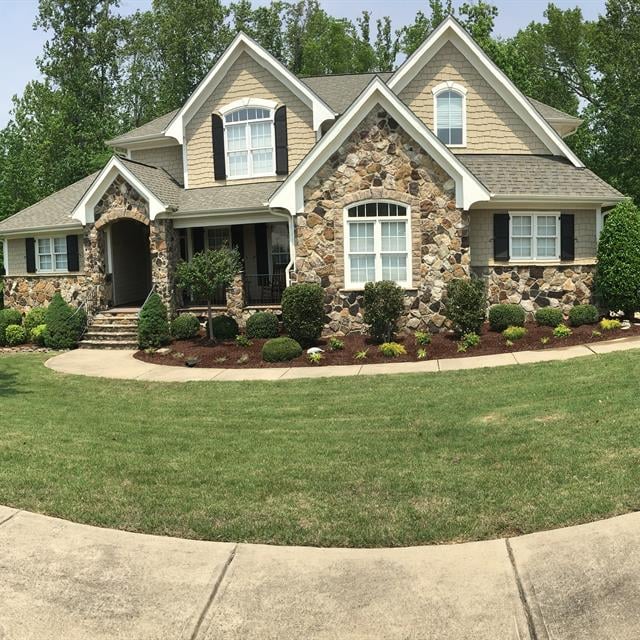 A front view of a house and its lawn.