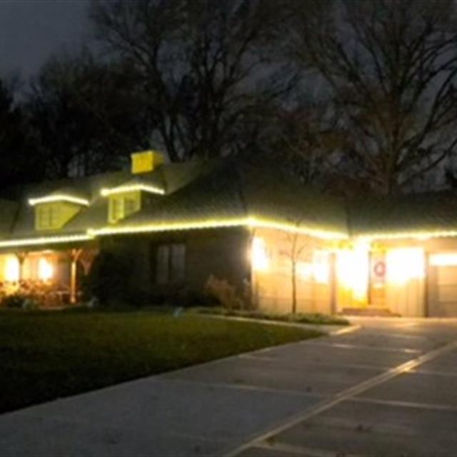 A house with outdoor lights.