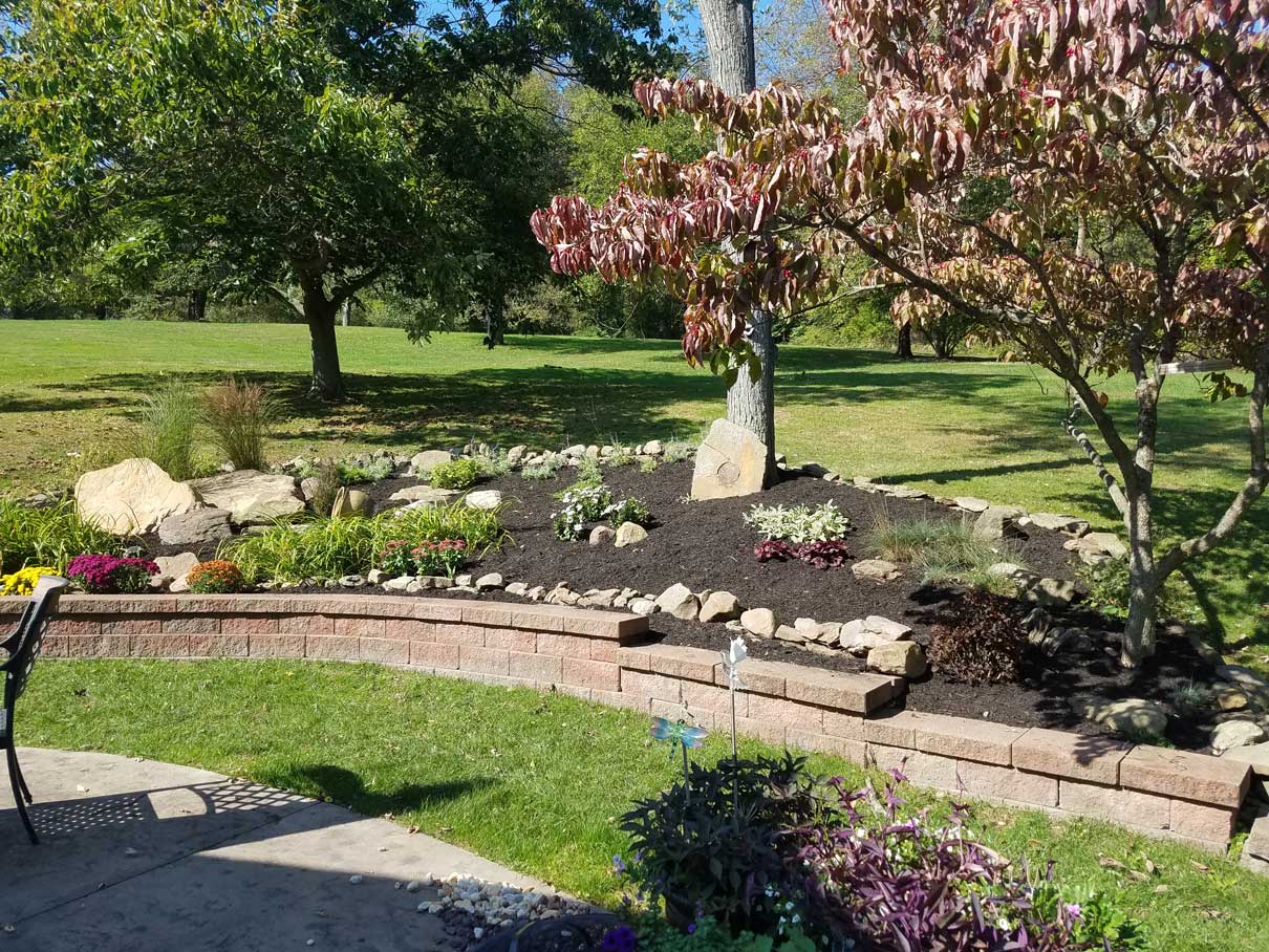 Planters with stone work and trees