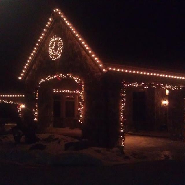 Christmas lights in front of a house.