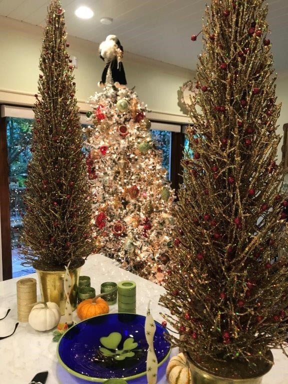 Christmas tree with two smaller trees on counter