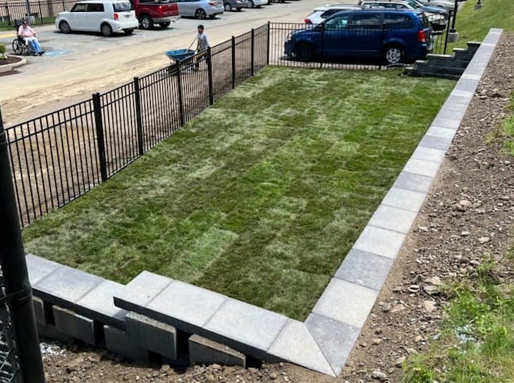 Fence and wall installation with sod in Whitehall