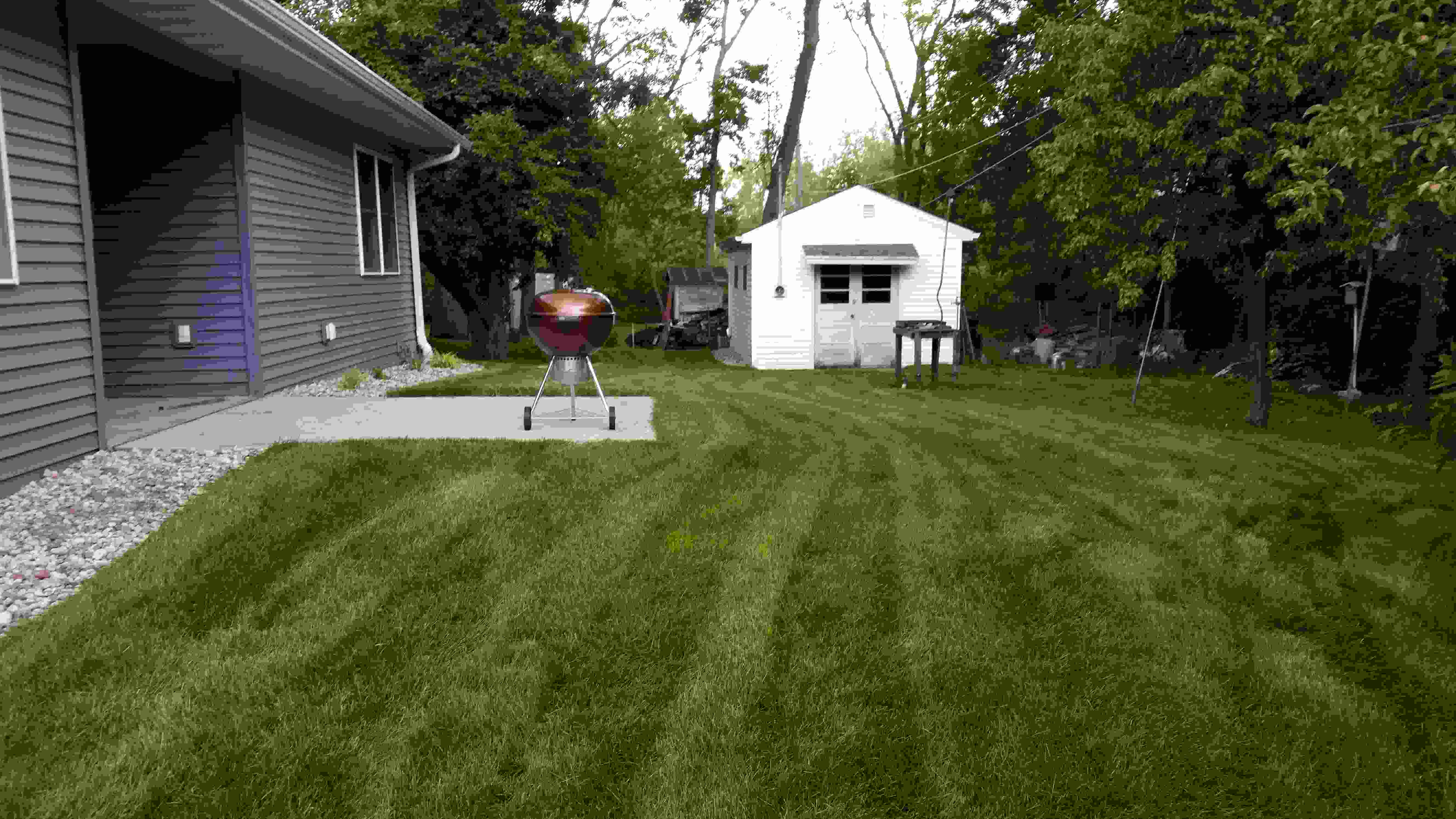 Well manicured lawn and side of house