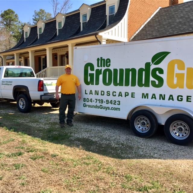 Ground guy employee with their truck and trailer