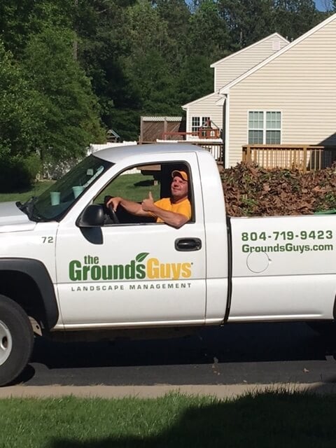 Grounds Guys truck and worker