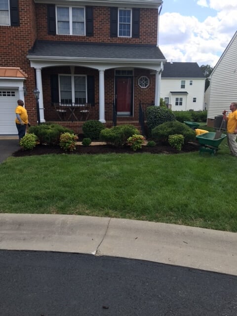 Grounds Guys working on planter