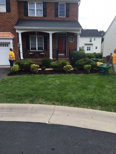 Grounds Guys working on planter