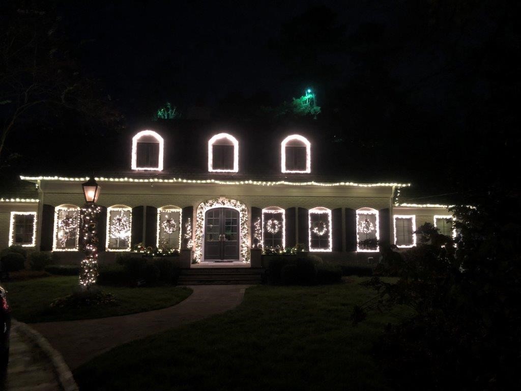 Holiday lighting three small second story windows 