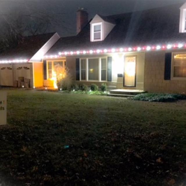 House with holiday lighting.