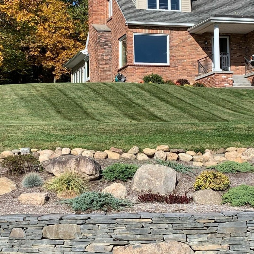 landscape using grass beds and stones