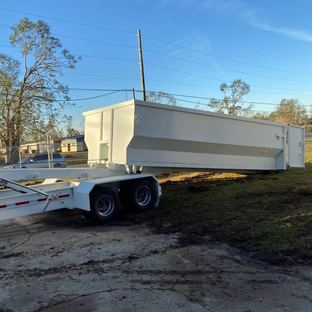 Landscapers dump truck in front yard