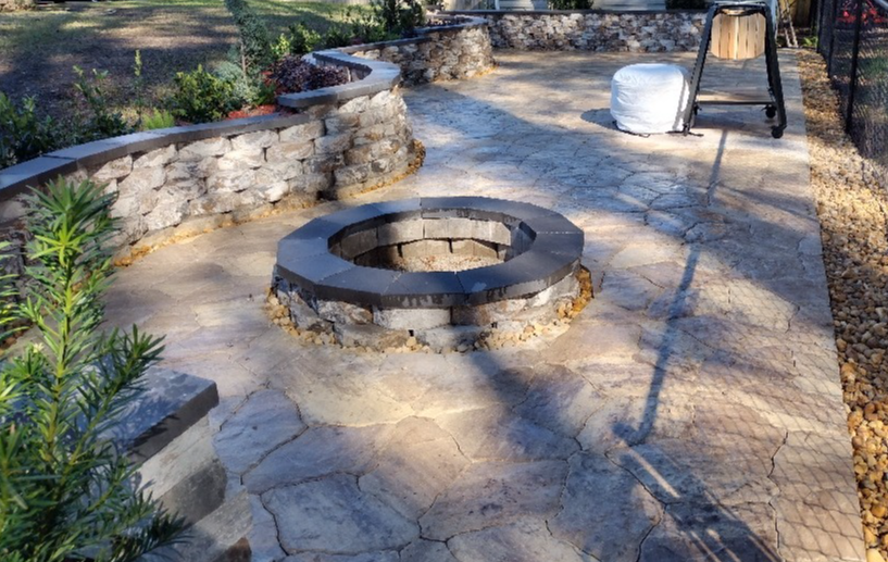 Full service design and installation of custom patio, retaining wall, firepit and landscaping