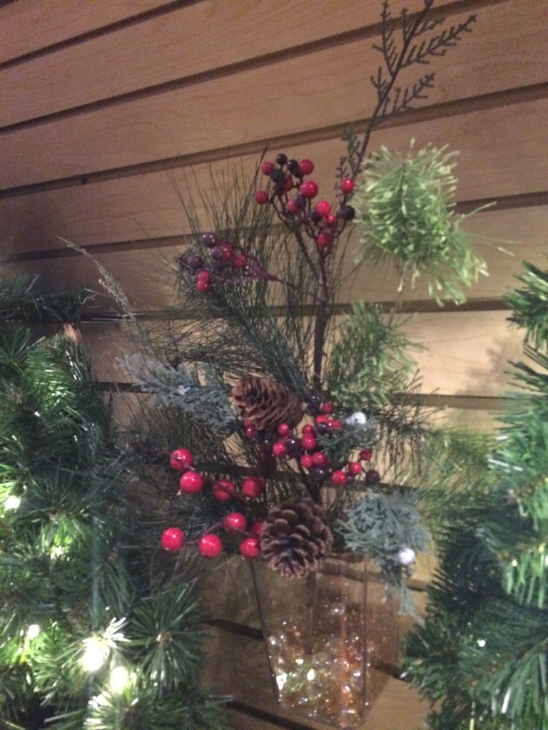 Pine Cones, berries and evergreen greenery in vase