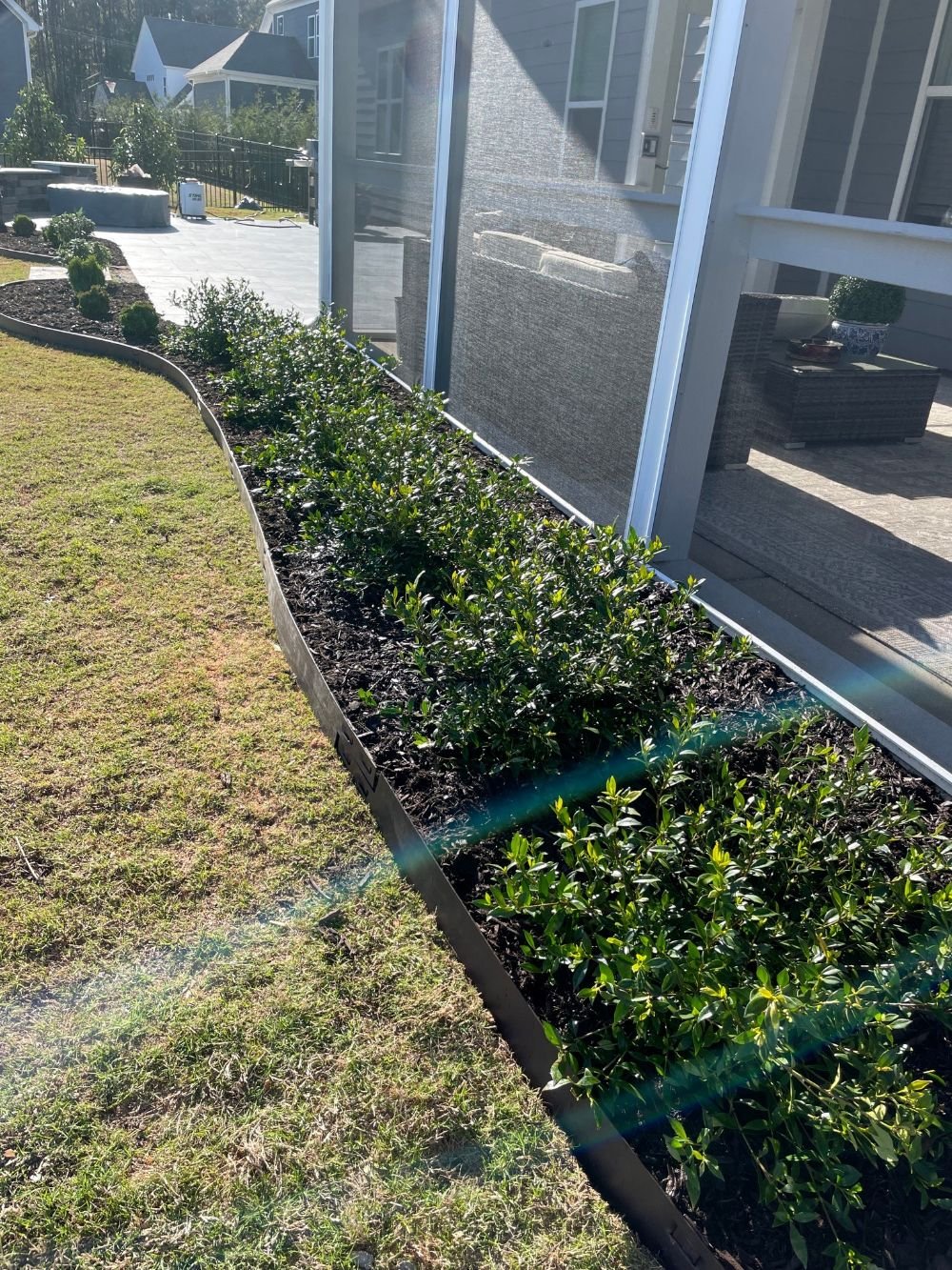 Screened in porch flower bed addition