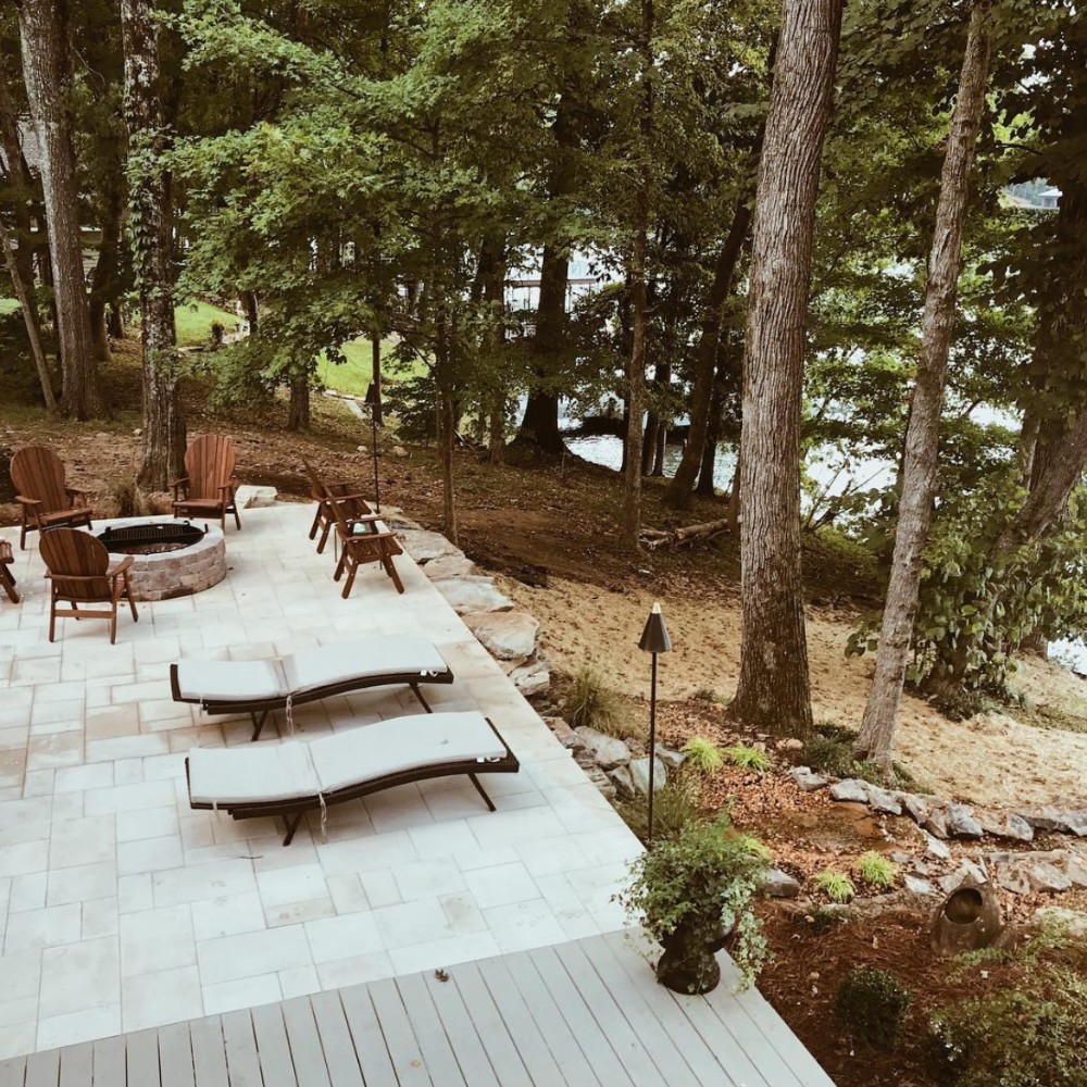 outdoor area over looking water with beautiful landscaping