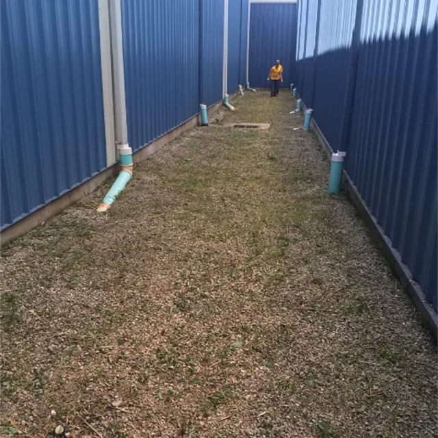 manicured corridor between two commercial buildings