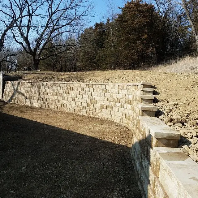 retaining wall with trees in background