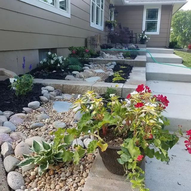 steps and flower beds outside a home