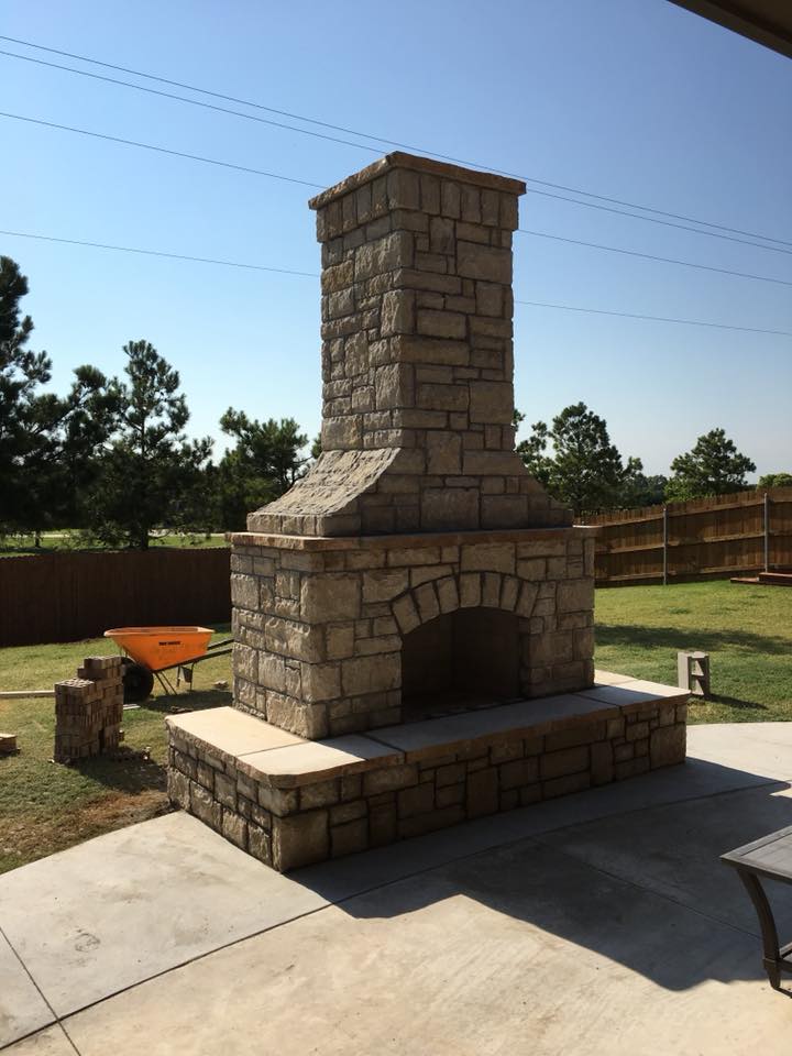 outdoor stone chimney and fireplace