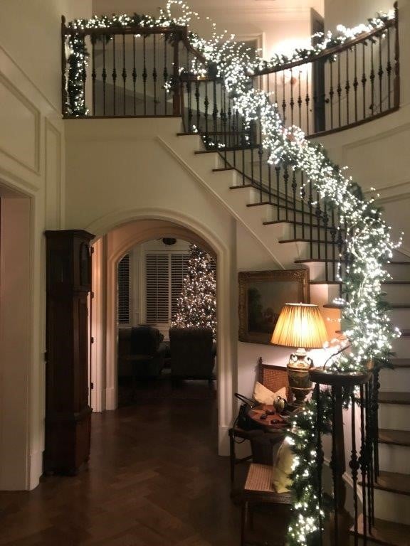 stair banister with holiday lights 