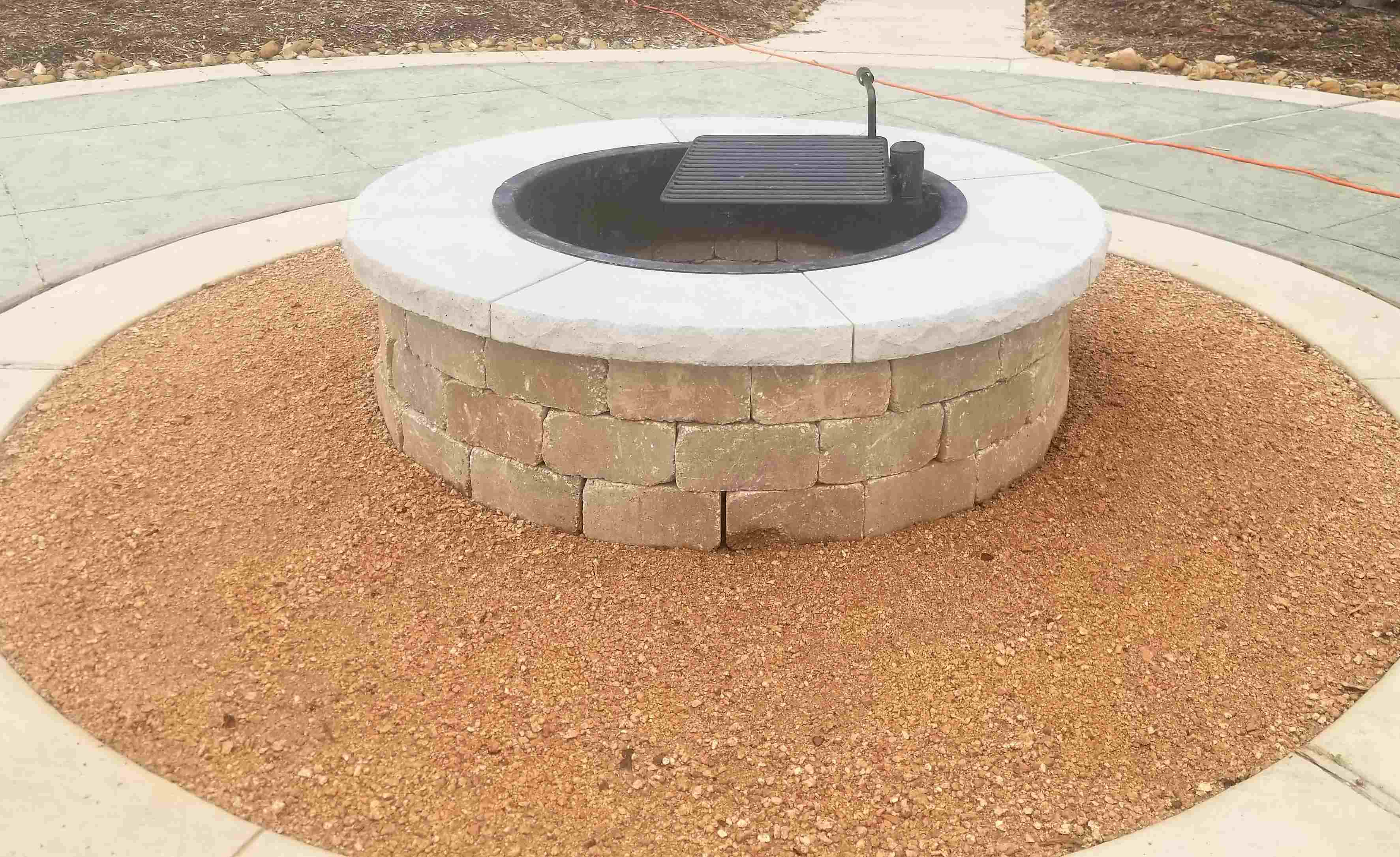 stone firepit with crushed granite