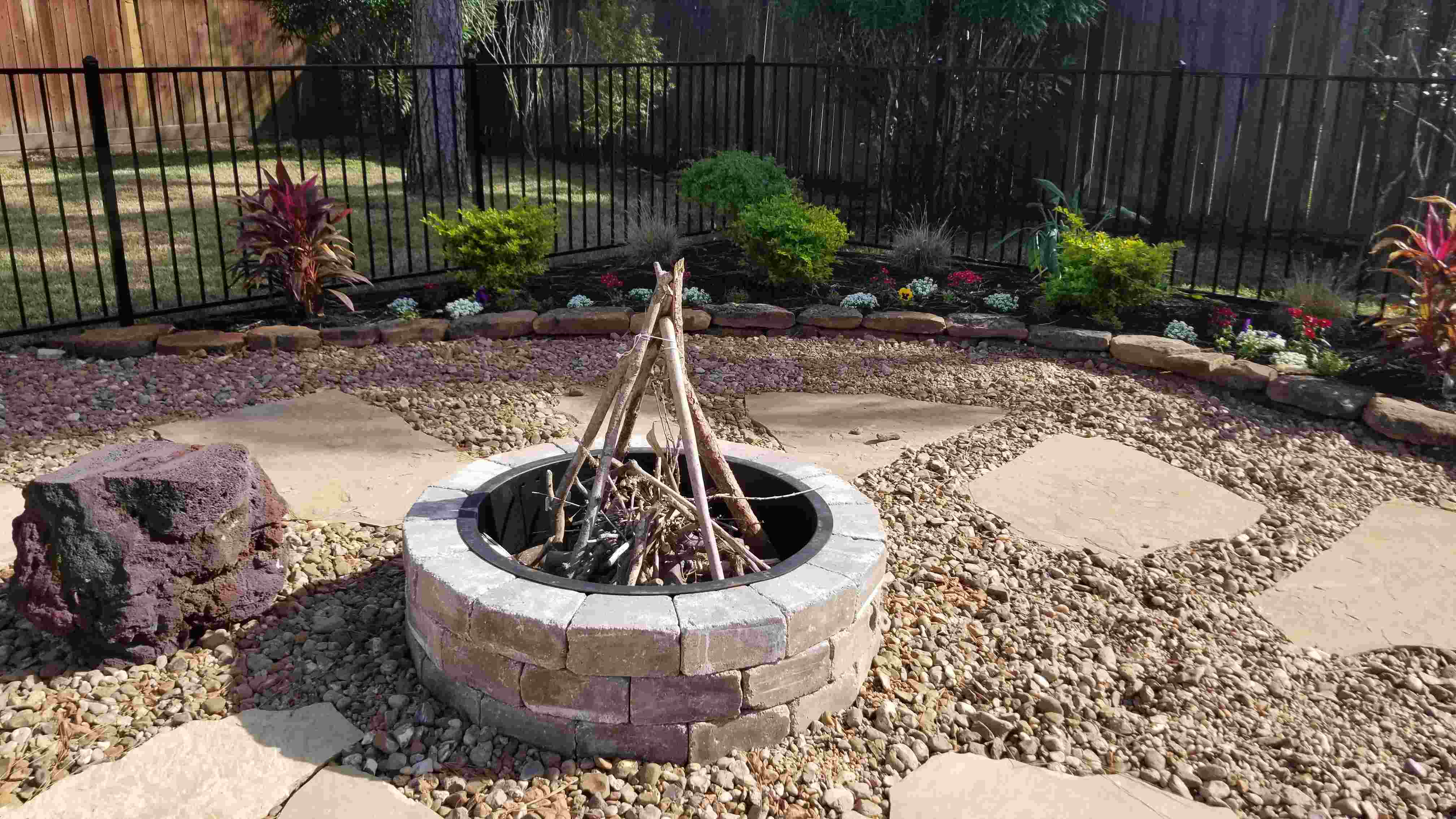 stone firepit with flagstone and bullrock