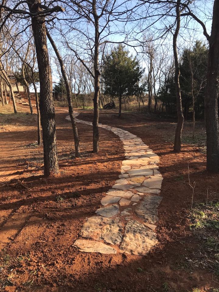 stone work walkway through trees