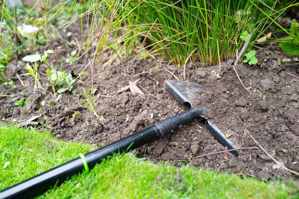 Half moon edger in flower bed