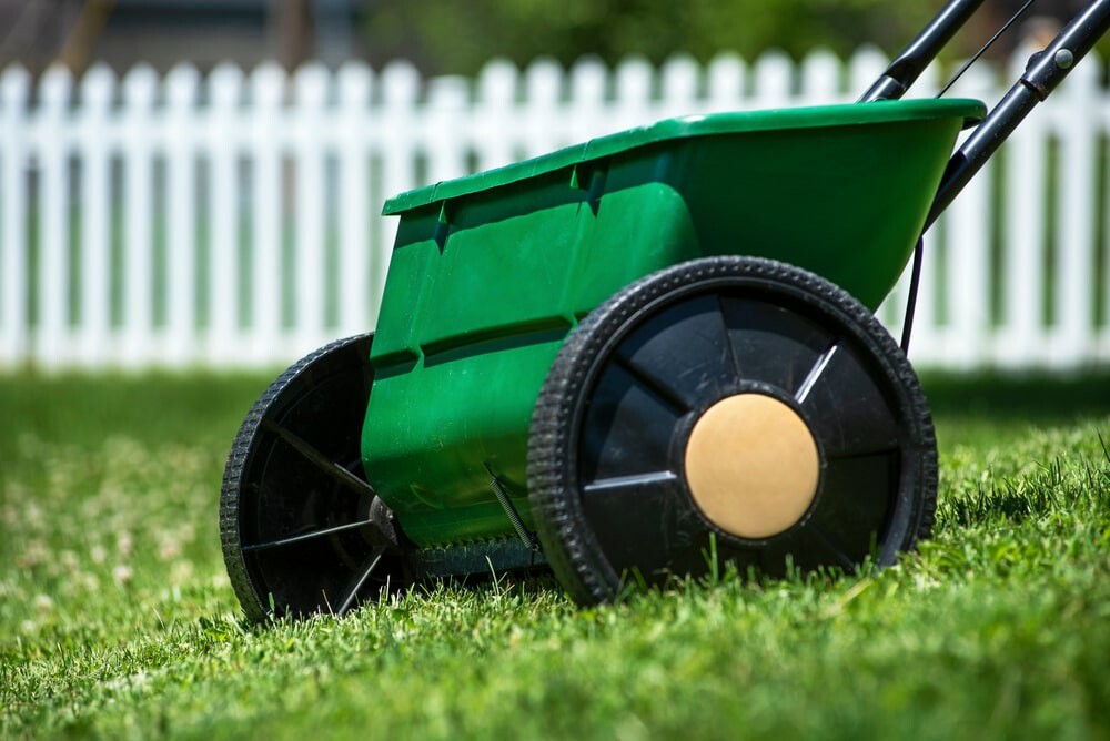 Seed spreader on grass