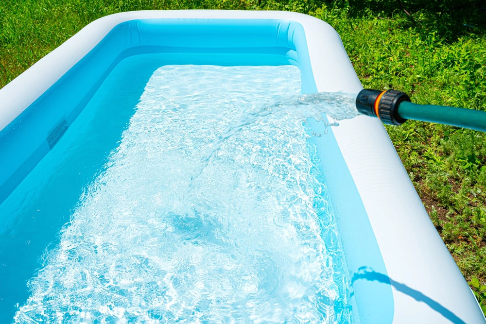 Inflatable swimming pool on residential lawn