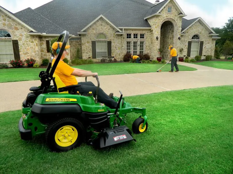 Grounds guys doing lawn mowing and edging (2)